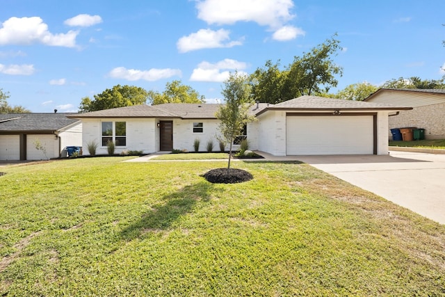 ranch-style home featuring a front yard and a garage