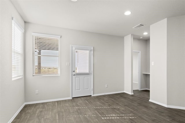 unfurnished room featuring dark hardwood / wood-style flooring