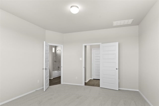 unfurnished bedroom with carpet