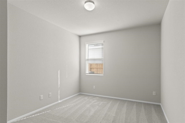 spare room with light carpet