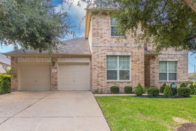 1001 Winding Creek Pl, Round Rock, TX 78665 - view of front of house with a garage, concrete driveway, a front lawn, brick siding, and a shingled roof
