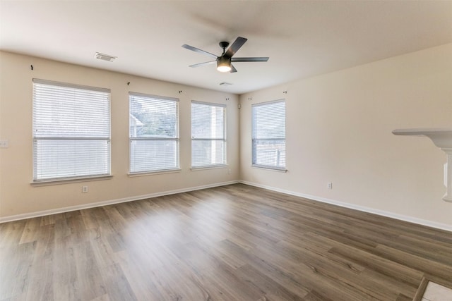 spare room featuring hardwood / wood-style flooring and ceiling fan