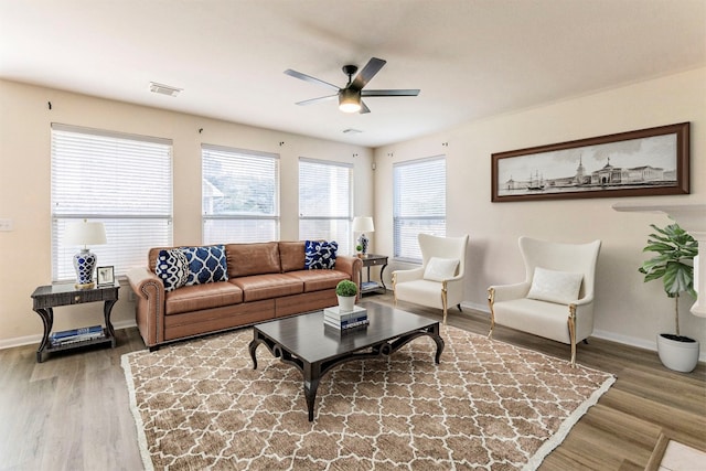 living room with ceiling fan and hardwood / wood-style flooring