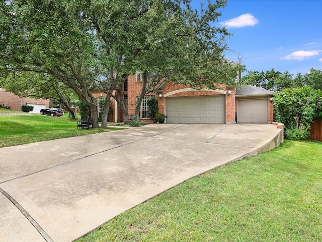 view of front facade with a garage and a front yard