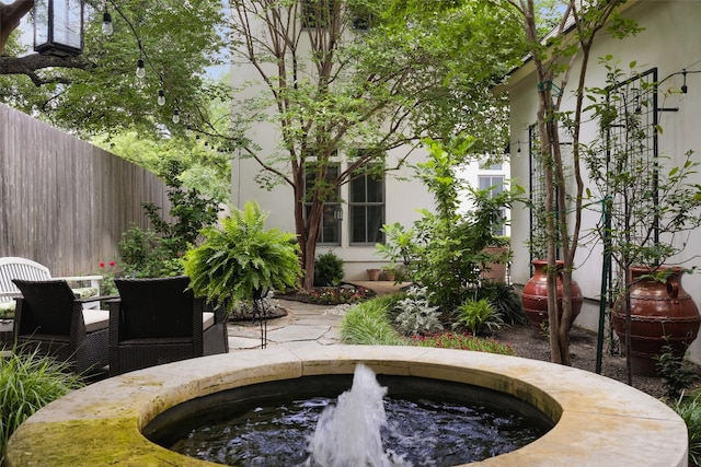 exterior space with a hot tub