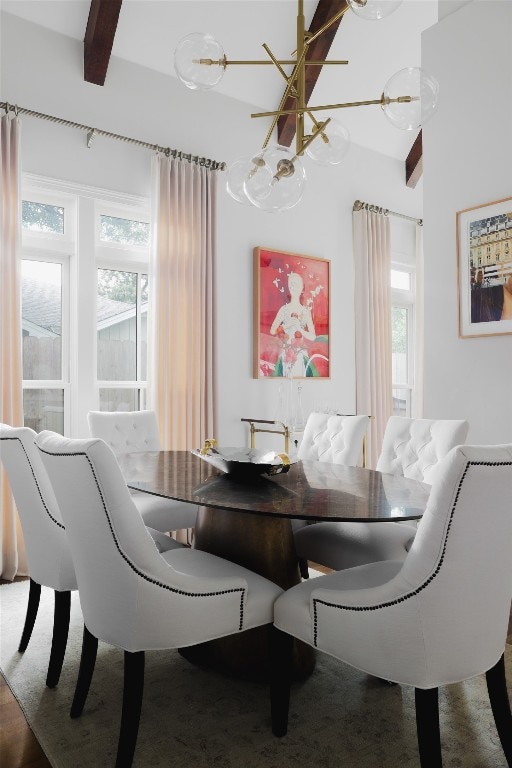 dining room with beamed ceiling, a notable chandelier, and carpet flooring