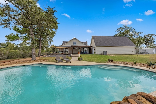 view of pool with a patio area, a lawn, a gazebo, and central AC unit