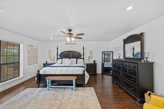 bedroom with dark wood-type flooring and ceiling fan