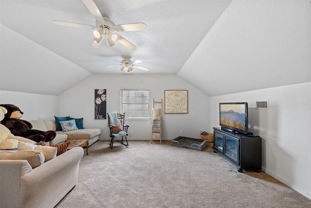 interior space with ceiling fan, a textured ceiling, and vaulted ceiling