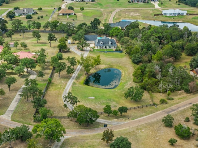 drone / aerial view featuring a water view and a rural view