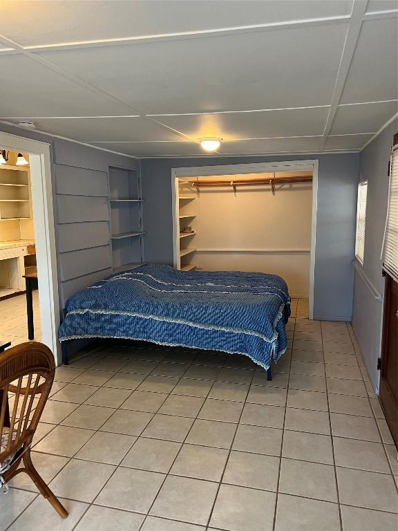 bedroom featuring tile patterned floors