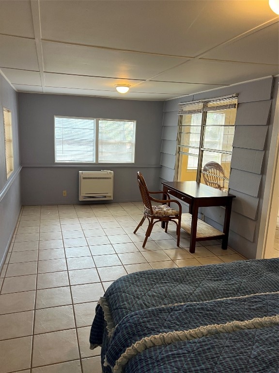 tiled bedroom featuring heating unit