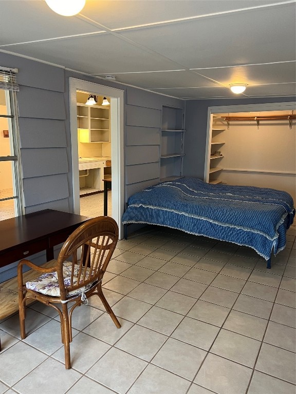 bedroom featuring tile patterned floors