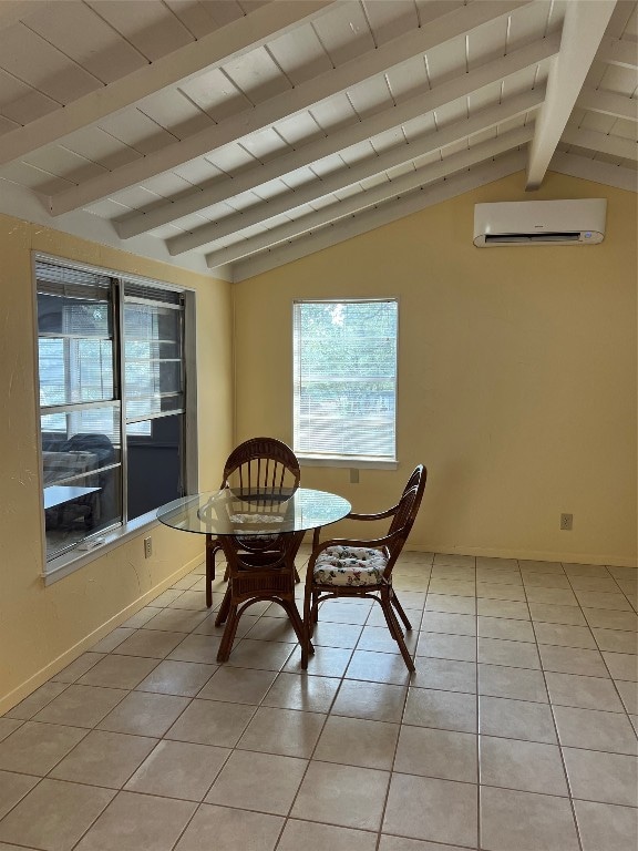 dining room with vaulted ceiling with beams, light tile patterned flooring, and a wall mounted air conditioner