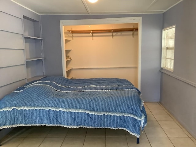 bedroom featuring a closet and tile patterned floors