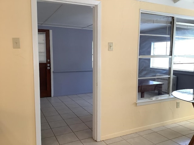 corridor featuring tile patterned flooring