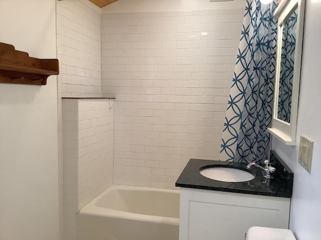 full bathroom with shower / bath combination with curtain, vanity, and toilet