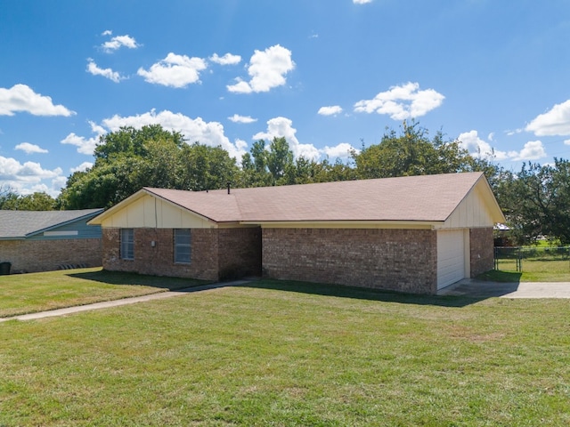 ranch-style house with a garage and a front yard