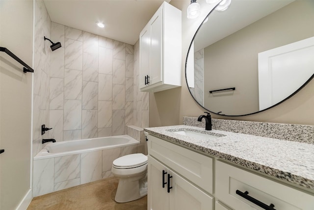 full bathroom with vanity, tiled shower / bath, and toilet