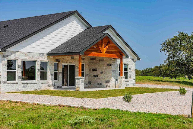 back of house featuring a yard