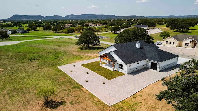 drone / aerial view featuring a mountain view