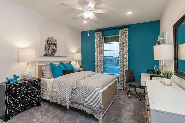 bedroom featuring dark colored carpet and ceiling fan