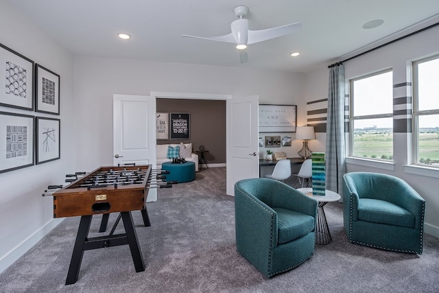 recreation room featuring carpet floors and ceiling fan