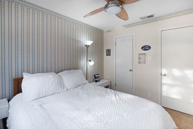 bedroom with ceiling fan and carpet