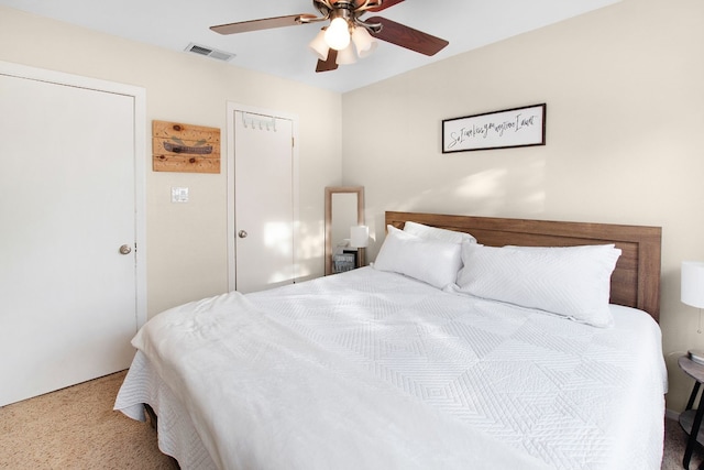 bedroom with ceiling fan and carpet floors