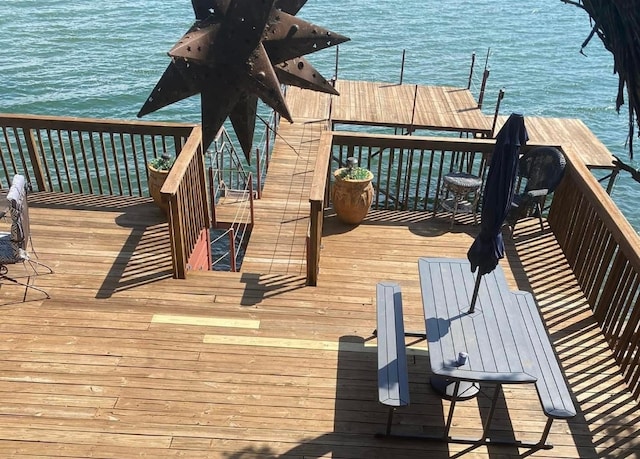 dock area with a water view