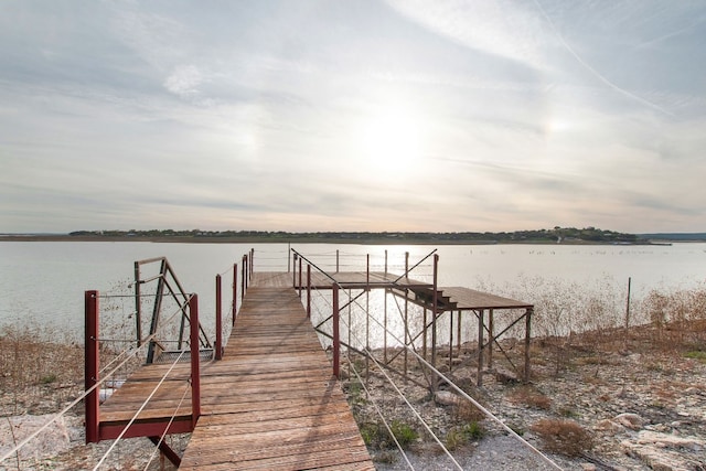 dock area with a water view