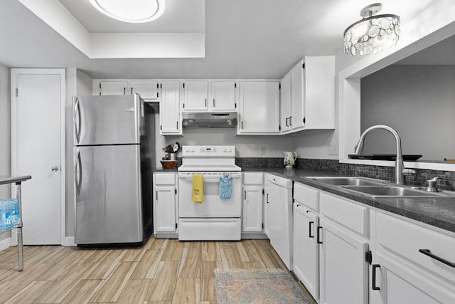 kitchen with light hardwood / wood-style floors, white appliances, white cabinetry, and sink