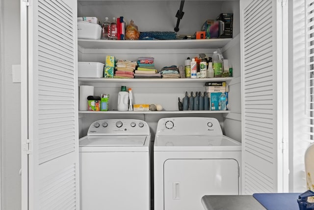 washroom with independent washer and dryer