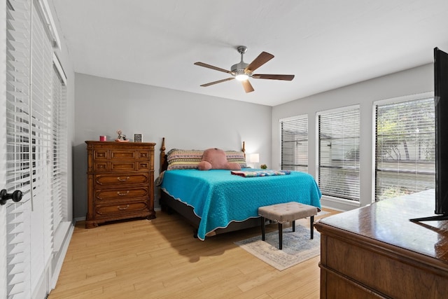 bedroom with light wood-type flooring and ceiling fan