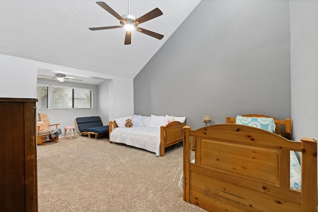 bedroom with carpet floors, a textured ceiling, lofted ceiling, and ceiling fan