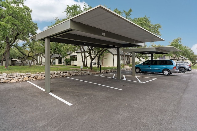 view of parking / parking lot with a carport