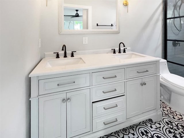 9614 Newfoundland Cir, Austin, TX 78758 - full bathroom featuring double vanity, a shower, and a ceiling fan