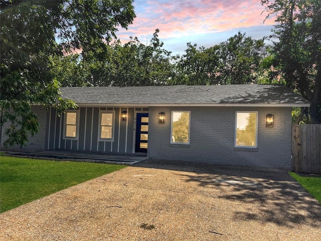 9614 Newfoundland Cir, Austin, TX 78758 - ranch-style house with brick siding, covered porch, and roof with shingles