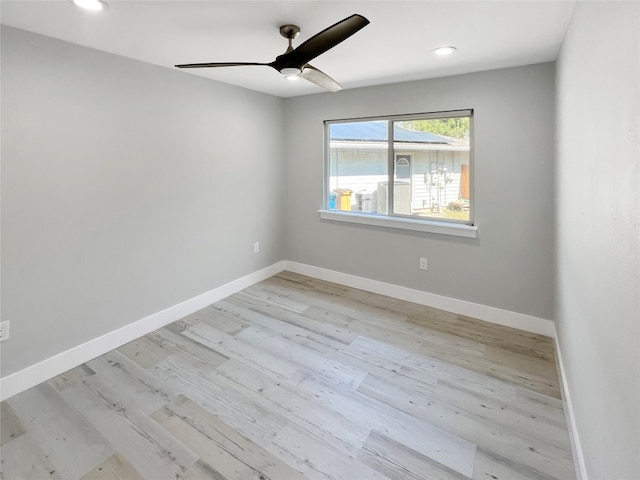 unfurnished room featuring ceiling fan and light hardwood / wood-style flooring