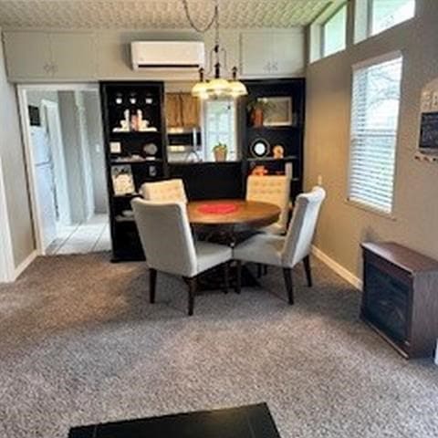 carpeted dining room featuring a wall mounted AC