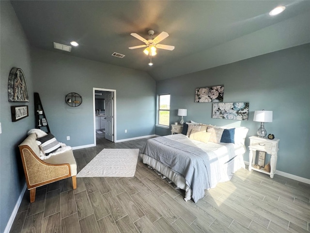 bedroom featuring lofted ceiling, ceiling fan, and hardwood / wood-style flooring