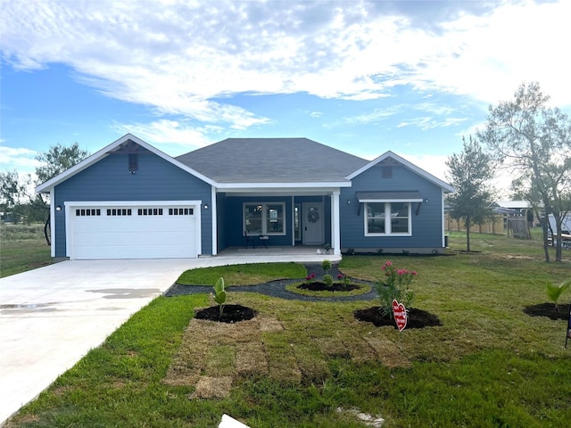 ranch-style home featuring a garage, a porch, and a front yard