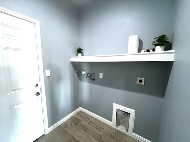 laundry room with hardwood / wood-style floors, hookup for an electric dryer, and gas dryer hookup