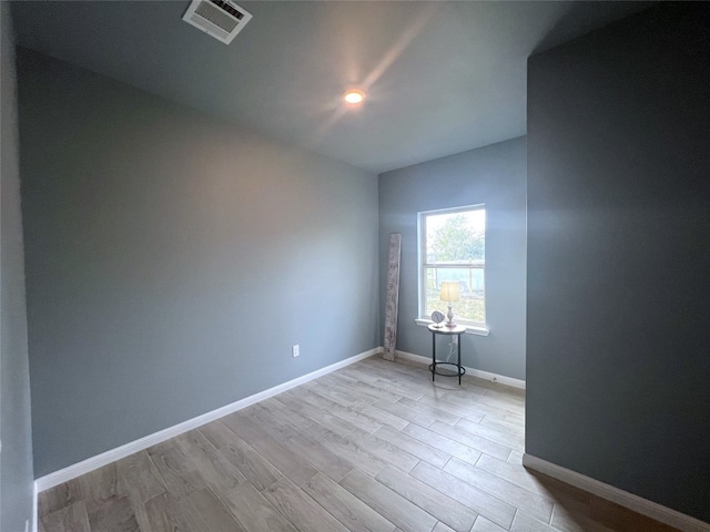 spare room with light hardwood / wood-style floors