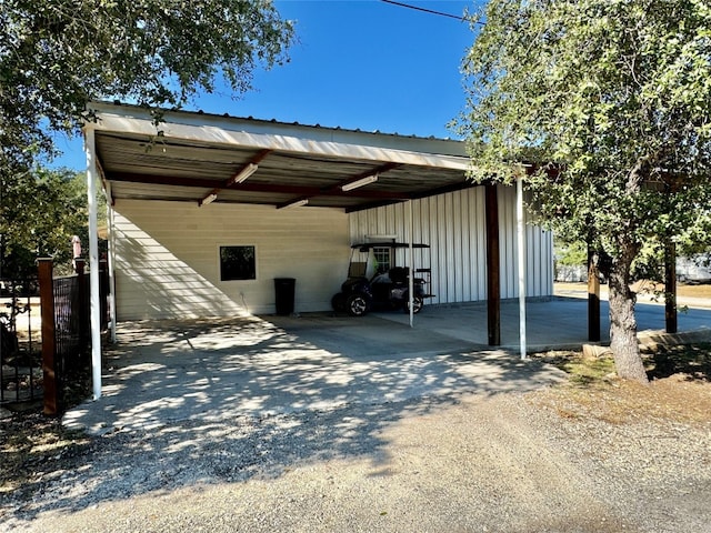 view of vehicle parking with a carport