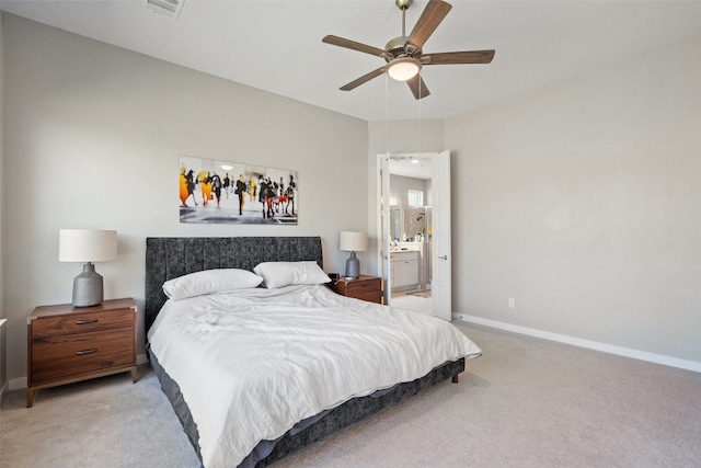 bedroom with light carpet, connected bathroom, and ceiling fan