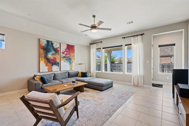 tiled living room featuring ceiling fan