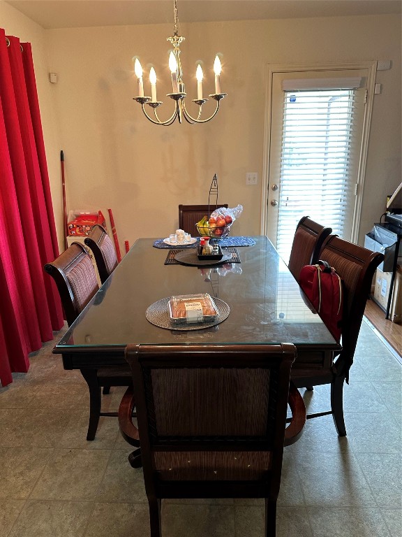 dining room with a notable chandelier