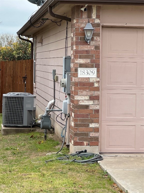 exterior space with a yard and cooling unit