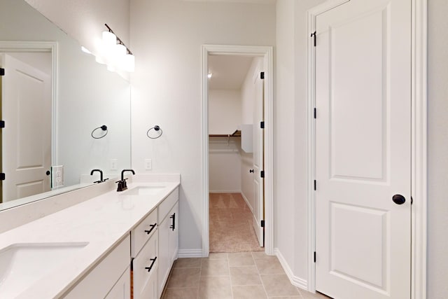 bathroom with tile patterned flooring and vanity